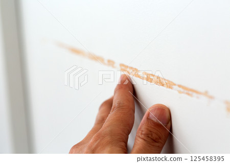 Scratches on wooden sliding door Scratches on wooden sliding door 125458395