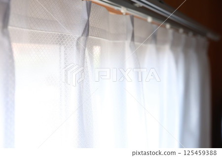 Curtain rail and curtains 125459388