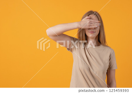 Woman Covering Eyes with Hand Woman Covering Eyes with Hand 125459393