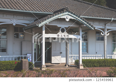 March 23 2025 Traditional Japanese Building Surrounded by Green Hills , Japan 125459961
