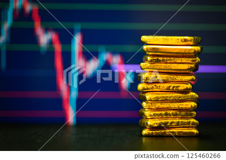 Photo a gold bars the candlestick chart background, Fluctuations in gold prices concept. Photo a gold bars the candlestick chart background, Fluctuations in gold prices concept. 125460266