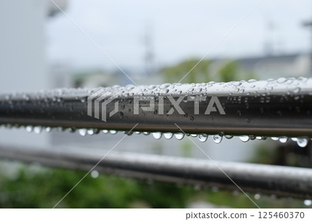 Clothesline on rainy day 125460370