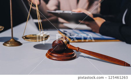 Concept of legal counseling. The lawyer or legal counsel is listening and providing advice to business people. 125461263
