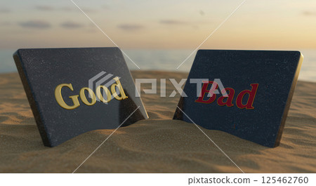 Two polished stone tablets rest on a sandy beach, each etched with a contrasting message. The left tablet displays the word Good in gold, while the right says Bad in red. 125462760