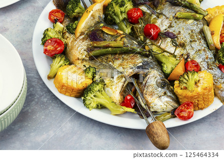 Fried dorado fish, seafood shashlik. Fried dorado fish, seafood shashlik. 125464334