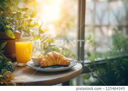 Breakfast at a small balcony table 125464345