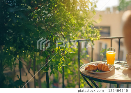 Breakfast at a small balcony table 125464346