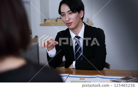 The image of unscrupulous salespeople forcing people into signing contracts 125465238
