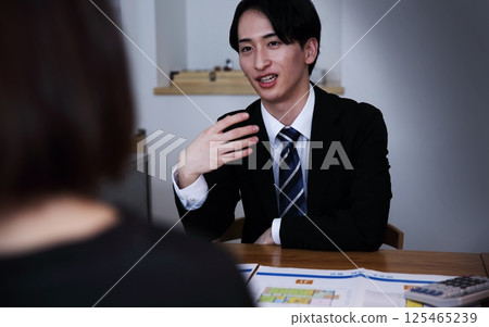 The image of unscrupulous salespeople forcing people into signing contracts 125465239