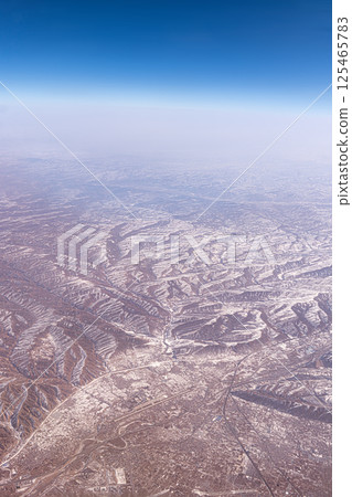 Mountain Ranges and Shanxi Province in China airplane view. Inner Mongolia mountain landscape of Mount Tangula Mountain Ranges and Shanxi Province in China airplane view. Inner Mongolia mountain landscape of Mount Tangula 125465783