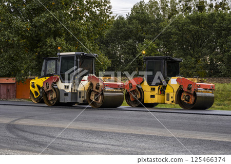 Two road rollers parked on highway construction site Two road rollers parked on highway construction site 125466374