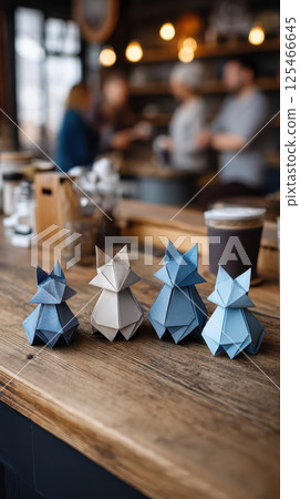 Origami foxes in cozy cafe setting, creating whimsical atmosphere Origami foxes in cozy cafe setting, creating whimsical atmosphere 125466645
