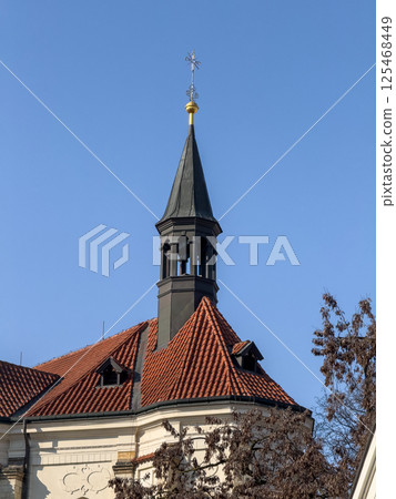 crucifix stands tall on the bell tower crucifix stands tall on the bell tower 125468449