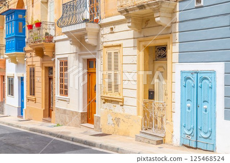 View of a typical Maltese street with old residential buildings in traditional architectural style, Malta 125468524