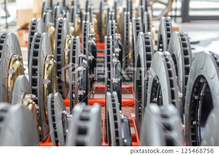 Checking car brake system for repair at car garage 125468756