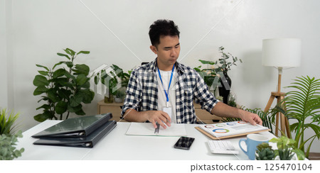 Business analysis with charts and graphs in modern office 125470104