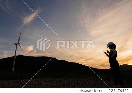 A young woman in red holds a beautifully decorated gift package, ready to surprise her loved ones on a special birthday. Isolate on white background. High quality photo 125470413