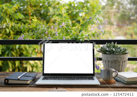 Cozy balcony study and workspace with coffee cup 125472411
