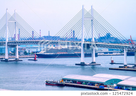 Yokohama cityscape in Japan, overlooking the luxury cruise ship Queen Elizabeth at Daikoku Pier (four luxury cruise ships in Yokohama) = April 26th 125472924
