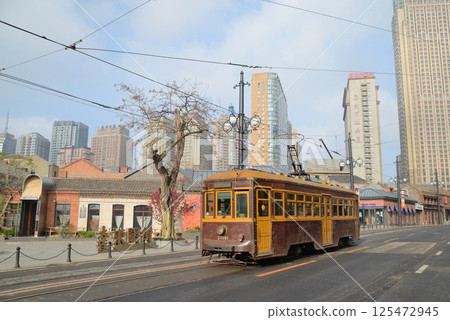 This is a tram in Dalian, China, which has been in use since the Japanese colonial period. This is a tram in Dalian, China, which has been in use since the Japanese colonial period. 125472945