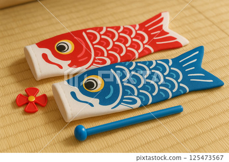 A mini carp streamer set placed on a tatami mat 125473567