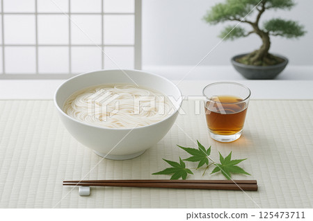 Summer somen noodles in a white porcelain bowl and through a paper screen 125473711