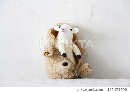 Stuffed sheep on a white background 125473799