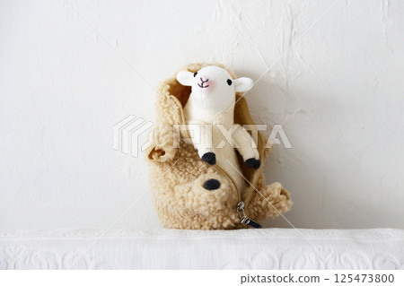 Stuffed sheep on a white background 125473800