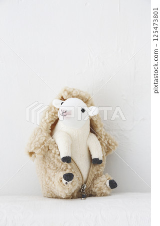 Stuffed sheep on a white background 125473801
