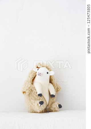 Stuffed sheep on a white background Stuffed sheep on a white background 125473805