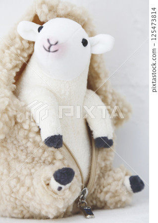 Stuffed sheep on a white background Stuffed sheep on a white background 125473814