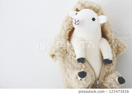 Stuffed sheep on a white background Stuffed sheep on a white background 125473816