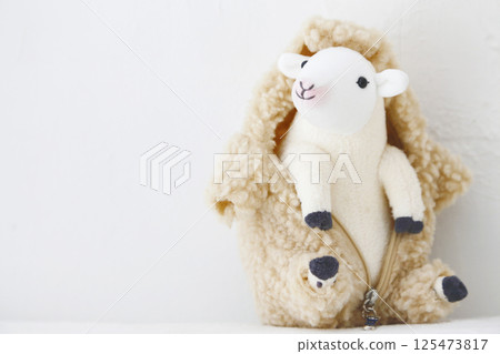 Stuffed sheep on a white background 125473817