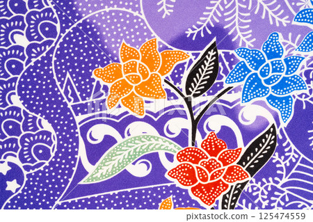 Photo of flower-patterned batik cloth that looks beautiful. 125474559