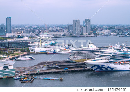Yokohama cityscape in Japan with three luxury cruise ships: Norwegian Spirit, Riviera, and Diamond Princess 125474961
