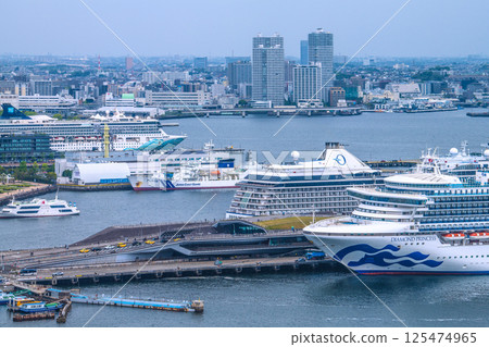 Yokohama cityscape in Japan with three luxury cruise ships: Norwegian Spirit, Riviera, and Diamond Princess Yokohama cityscape in Japan with three luxury cruise ships: Norwegian Spirit, Riviera, and Diamond Princess 125474965