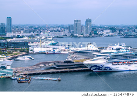 Yokohama cityscape in Japan with three luxury cruise ships: Norwegian Spirit, Riviera, and Diamond Princess Yokohama cityscape in Japan with three luxury cruise ships: Norwegian Spirit, Riviera, and Diamond Princess 125474979