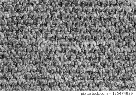 Texture of gray jacquard fabric of rough weave structure close up, macro, background Texture of gray jacquard fabric of rough weave structure close up, macro, background 125474989