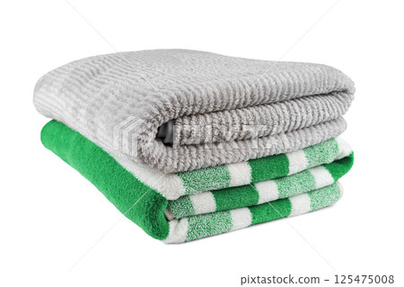 Soft fluffy striped grey and green bath towels folded in stack isolated on white background 125475008