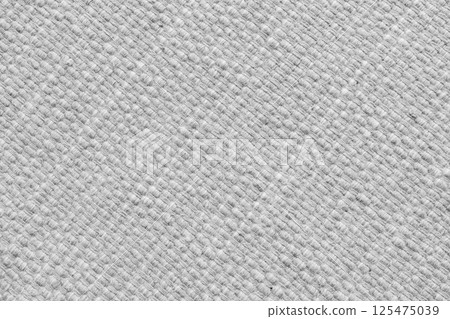 Texture of white natural fabric with large diagonal weaving. Upholstery, cloth background Texture of white natural fabric with large diagonal weaving. Upholstery, cloth background 125475039