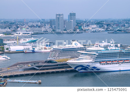 Yokohama cityscape in Japan with three luxury cruise ships: Norwegian Spirit, Riviera, and Diamond Princess Yokohama cityscape in Japan with three luxury cruise ships: Norwegian Spirit, Riviera, and Diamond Princess 125475091