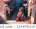 A young woman in a kimono stands on a stone-paved street in Kyoto on a moonlit night with cherry blossoms falling 125476110