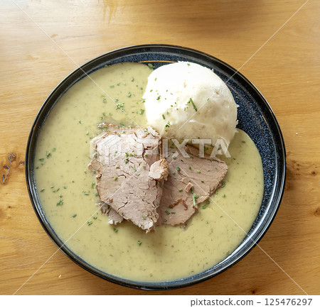 Mashed potatoes with dietary turkey meat in creamy sauce on a plate. Top view Mashed potatoes with dietary turkey meat in creamy sauce on a plate. Top view 125476297