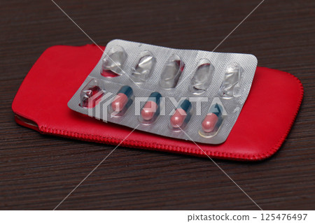 Half used pill blister 125476497
