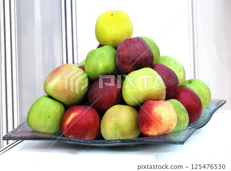 Organic apples on plate Organic apples on plate 125476530