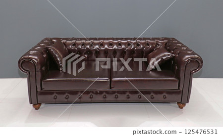 Retro shiny leather couch 125476531