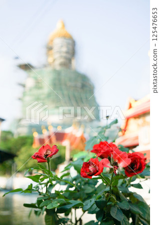 A giant Buddha statue at Wat Paknam Phasicharoen temple in Bangkok undergoing repairs 125476653