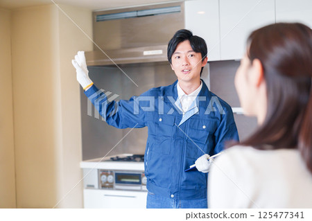 A man inspecting apartments by visiting each apartment 125477341