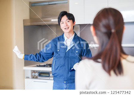 A man inspecting apartments by visiting each apartment 125477342