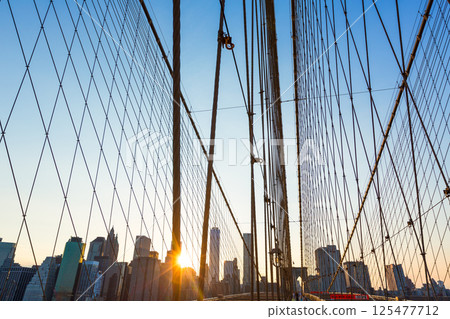 Brooklyn Bridge sunset with Manhattan skyline US 125477712